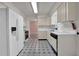 Charming kitchen features modern appliances, patterned flooring and plenty of cabinet space at 2675 Paul Thomas Dr, Dacula, GA 30019