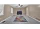 Spacious living room featuring tile flooring, a cozy fireplace, and abundant natural light at 2675 Paul Thomas Dr, Dacula, GA 30019