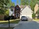 Charming two-story home with brick and vinyl siding, manicured lawn, and two-car garage at 3063 Grace Ct, Lawrenceville, GA 30043