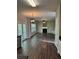 Open-concept living room with hardwood floors, fireplace, and access to a backyard patio at 3063 Grace Ct, Lawrenceville, GA 30043