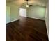 Spacious living room featuring hardwood floors, ceiling fan, and bright lighting at 3063 Grace Ct, Lawrenceville, GA 30043