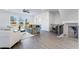 Open-concept living area with hardwood floors, modern furnishings, and abundant natural light at 3078 Hudson Glen Way, Dacula, GA 30019