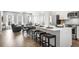 Open-concept living room showcasing a modern kitchen, dining area, and a comfortable seating arrangement at 3078 Hudson Glen Way, Dacula, GA 30019