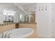 Elegant bathroom features a soaking tub with tile surround, mosaic accents, and a spacious layout at 325 E Paces Ferry Ne Rd # 602, Atlanta, GA 30305