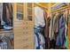 Organized walk-in closet featuring custom cabinetry, drawers, and shelving for optimal storage at 325 E Paces Ferry Ne Rd # 602, Atlanta, GA 30305