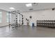 Well-equipped gym with weight racks, weight bench and accessories for a full body workout at 325 E Paces Ferry Ne Rd # 602, Atlanta, GA 30305