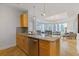 Kitchen island with barstool seating and granite countertops, flowing into living area at 325 E Paces Ferry Ne Rd # 602, Atlanta, GA 30305