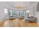 Bright living room featuring hardwood floors, large windows, and modern decor at 325 E Paces Ferry Ne Rd # 602, Atlanta, GA 30305