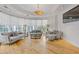 Bright living room featuring hardwood floors, large windows, and modern decor at 325 E Paces Ferry Ne Rd # 602, Atlanta, GA 30305