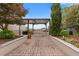 Outdoor patio area with grill and dining set in a secluded garden setting at 325 E Paces Ferry Ne Rd # 602, Atlanta, GA 30305