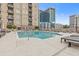 Stunning pool area with a deck and comfortable lounge chairs perfect for relaxing in the sun at 325 E Paces Ferry Ne Rd # 602, Atlanta, GA 30305
