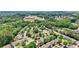 Scenic aerial shot featuring a residential area close to schools surrounded by green space and tree cover at 409 Norton Xing, Woodstock, GA 30188