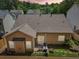 A cozy backyard featuring a small patio with outdoor furniture and ambient string lights at 409 Norton Xing, Woodstock, GA 30188