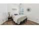 Cozy bedroom features natural light from the window and hardwood flooring at 409 Norton Xing, Woodstock, GA 30188