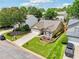 Attractive home featuring a well-manicured lawn, two-car garage, and a charming front garden area at 409 Norton Xing, Woodstock, GA 30188