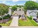 Beautiful home with a well-kept lawn and inviting landscaping enhances curb appeal at 409 Norton Xing, Woodstock, GA 30188
