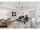 Open-concept living room flowing into the dining area, showcasing ample natural light at 409 Norton Xing, Woodstock, GA 30188