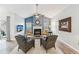 Bright living room with fireplace, vaulted ceiling, and sliding door to the backyard at 409 Norton Xing, Woodstock, GA 30188