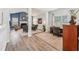 Cozy living room with a fireplace, vaulted ceiling, and comfortable seating area at 409 Norton Xing, Woodstock, GA 30188
