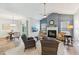 Spacious living room with a fireplace, open layout, and access to the dining area at 409 Norton Xing, Woodstock, GA 30188