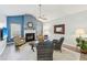 Inviting living room features a fireplace, vaulted ceiling, and stylish furnishings at 409 Norton Xing, Woodstock, GA 30188