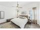 Spacious main bedroom with wooden bed frame, white bedding and hardwood flooring at 409 Norton Xing, Woodstock, GA 30188
