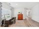 Well-lit home office with a wooden desk, comfortable chair, bright natural light, and elegant decor at 409 Norton Xing, Woodstock, GA 30188