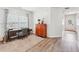 Bright home office with a wooden desk, comfortable chair, natural light, and elegant wooden storage at 409 Norton Xing, Woodstock, GA 30188