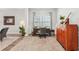 Home office featuring a wooden desk, comfortable chair, natural light, and stylish decor at 409 Norton Xing, Woodstock, GA 30188