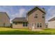 Back exterior featuring a grassy yard and neutral siding at 4870 Heather Mill Trce, Snellville, GA 30039