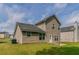 Well maintained backyard with plush green lawn with view of neutral siding of home at 4870 Heather Mill Trce, Snellville, GA 30039