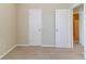 This bedroom boasts neutral walls, plush carpet, two doors, and a walk-in bathroom at 4870 Heather Mill Trce, Snellville, GA 30039