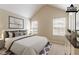 Virtually staged bedroom offers carpet, two windows, vaulted ceilings, and fresh paint at 4870 Heather Mill Trce, Snellville, GA 30039