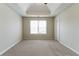 This bedroom features a large window providing great light and potential for a personalized space at 4870 Heather Mill Trce, Snellville, GA 30039