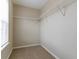 Walk-in closet with carpet and wire shelving offers ample storage space at 4870 Heather Mill Trce, Snellville, GA 30039