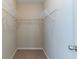 Walk-in closet offers carpet and metal rack shelving to maximize storage space at 4870 Heather Mill Trce, Snellville, GA 30039