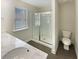 Bathroom featuring a glass shower and double vanity at 7721 Fawn Cir, Covington, GA 30014