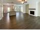 Open-concept living area featuring modern flooring and a fireplace at 7721 Fawn Cir, Covington, GA 30014