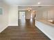 Open-concept living area with hardwood floors and views of the kitchen at 7721 Fawn Cir, Covington, GA 30014