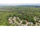 An aerial view of the neighborhood homes nestled among lush, green trees and landscaping at 1440 Water View Ln, Suwanee, GA 30024