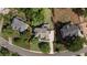 Aerial view of a home with a well-defined property line and well-manicured lawn in a residential neighborhood at 1440 Water View Ln, Suwanee, GA 30024