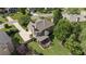 Aerial view of a house with screened porch, deck, and lush green lawn at 1440 Water View Ln, Suwanee, GA 30024