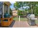 Back deck featuring a BBQ grill, built-in bar, and grilling and entertainment space at 1440 Water View Ln, Suwanee, GA 30024