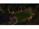 Expansive backyard featuring a well-manicured lawn, a deck, and mature trees, perfect for outdoor enjoyment at 1440 Water View Ln, Suwanee, GA 30024