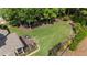 Sprawling backyard with lush green grass and mature trees at 1440 Water View Ln, Suwanee, GA 30024