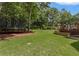 Expansive backyard featuring a trampoline and a multi-level deck, perfect for outdoor activities at 1440 Water View Ln, Suwanee, GA 30024