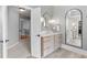 Elegant bathroom with a modern vanity, statement mirrors, and stylish lighting fixtures, creating a luxurious feel at 1440 Water View Ln, Suwanee, GA 30024