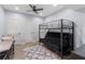 Finished bedroom with bunk beds, a ceiling fan, and multiple storage options at 1440 Water View Ln, Suwanee, GA 30024
