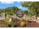 The River Mist community entrance sign is surrounded by landscaping and beautiful greenery at 1440 Water View Ln, Suwanee, GA 30024