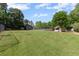 Expansive green space with a soccer field, playground, and covered picnic area at 1440 Water View Ln, Suwanee, GA 30024